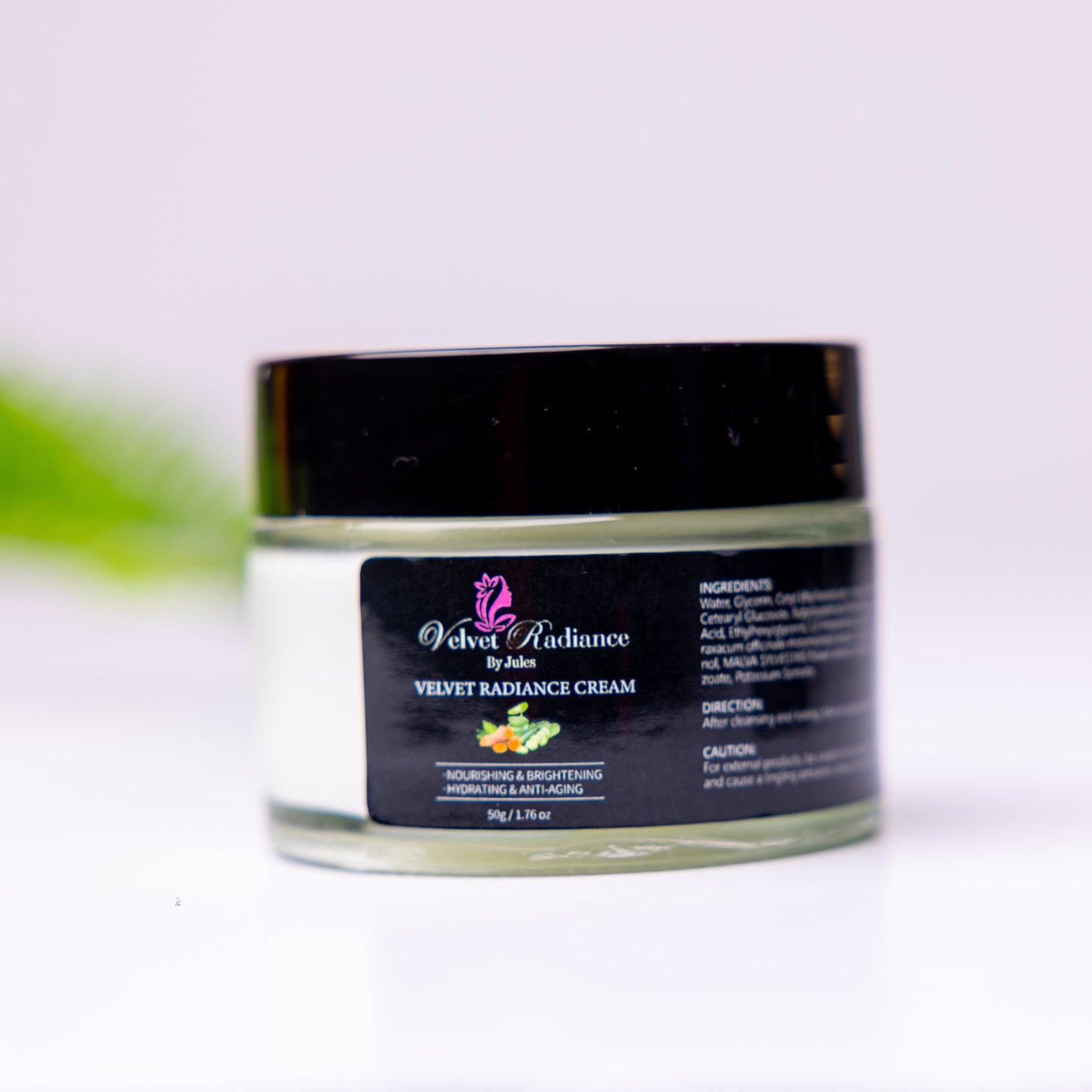 Jar of cream with a black lid on a white background