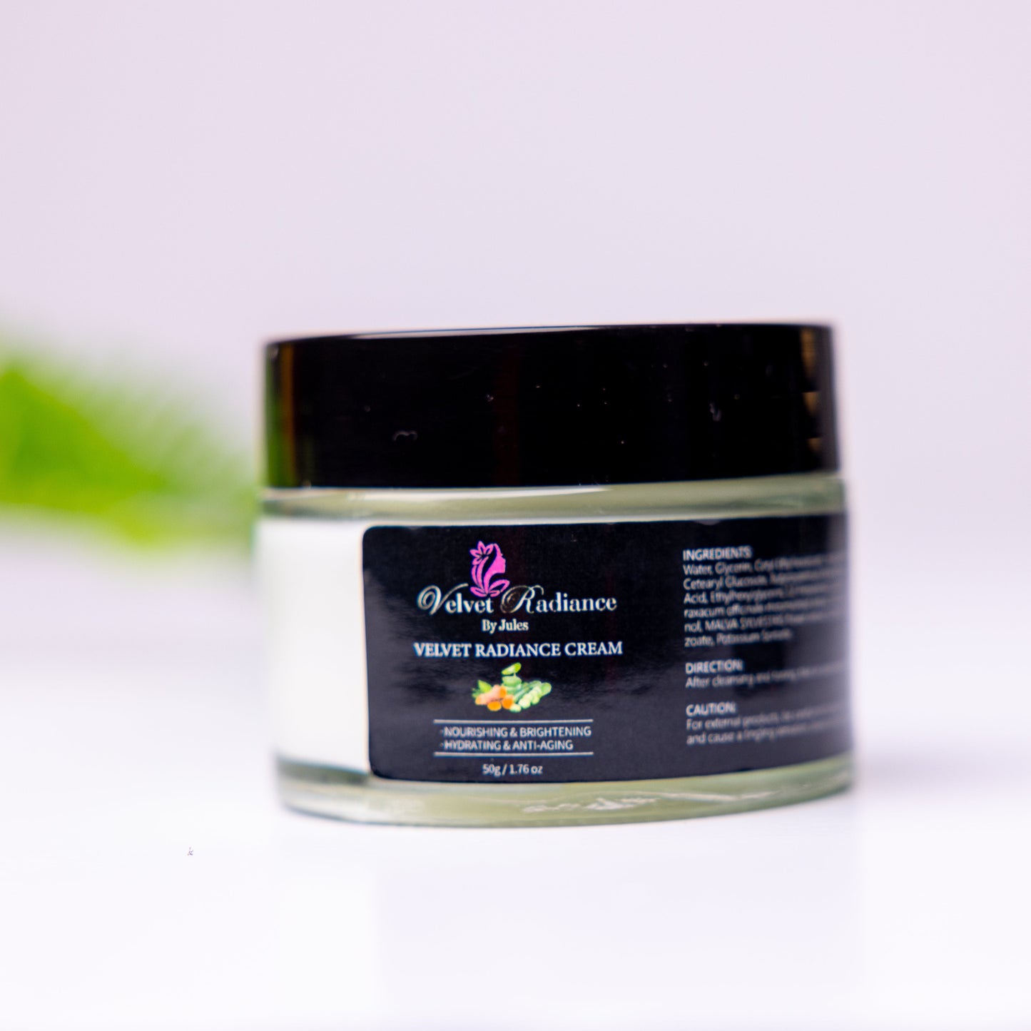 Jar of cream with a black lid on a white background